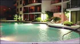 Watercrest pool at night with sun decks